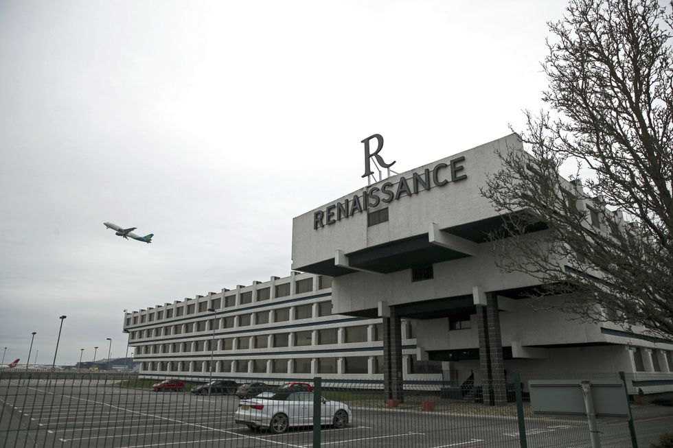 A plane flies over the Renaissance Hotel near Heathrow Airport, London. From Monday UK nationals or residents returning to England from 33 %22red list%22 countries will be required to spend 10 days in a Government-designated quarantine hotel upon arrival. Picture date: Sunday February 14, 2021.
