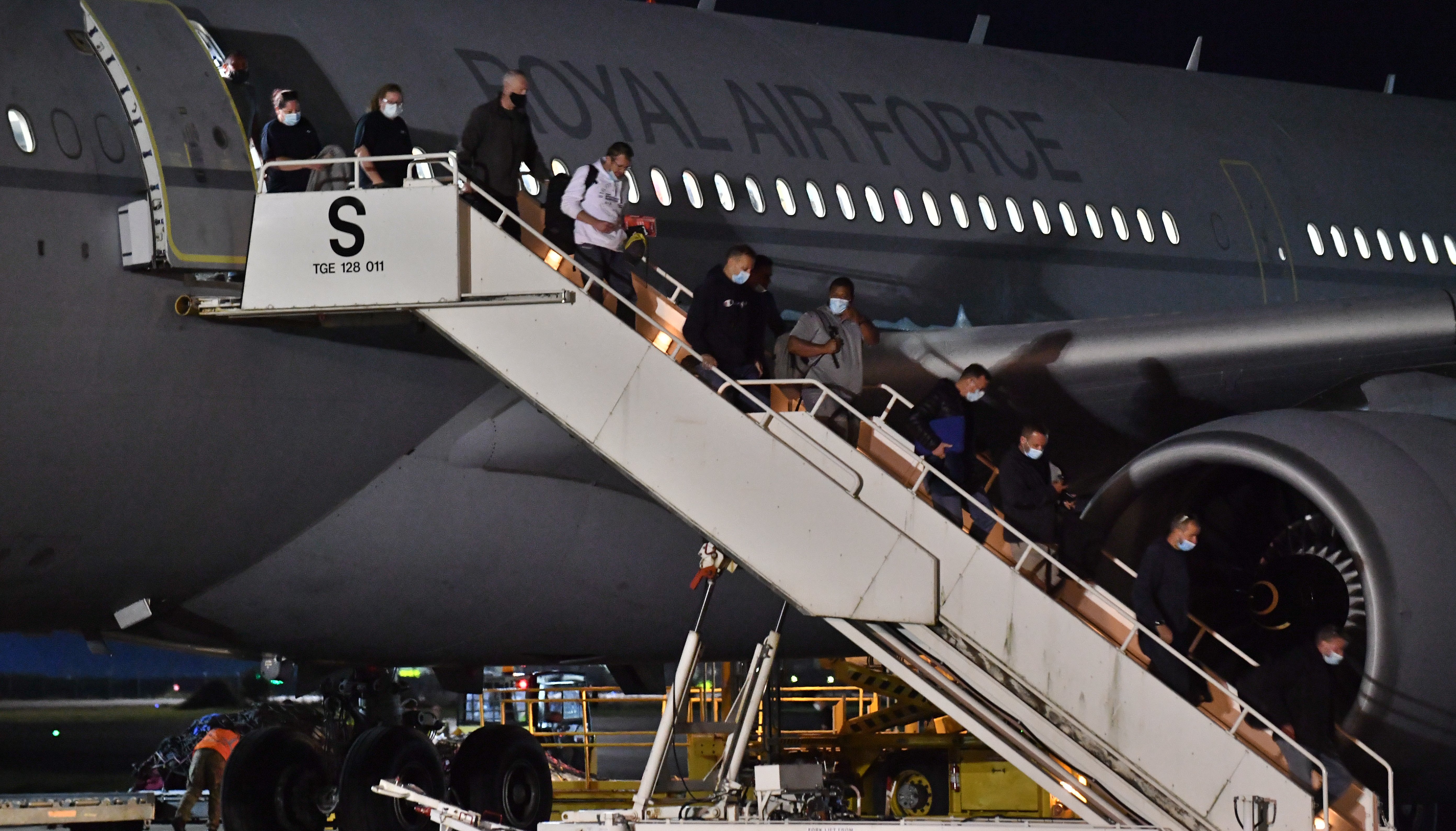 A plane lands at RAF Brize Norton, Oxfordshsire, carrying British nationals and Afghans from Kabal in Afghanistan.