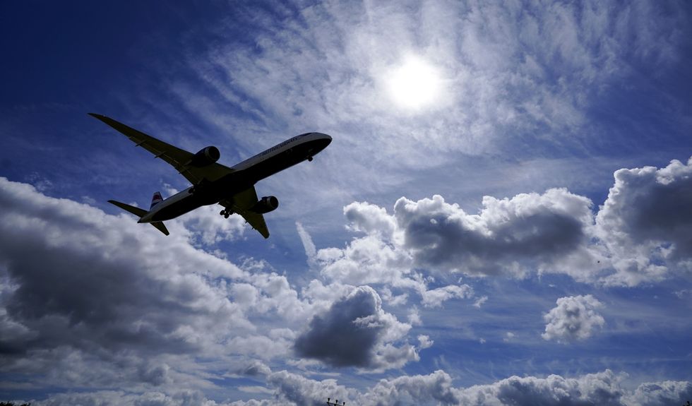 A plane lands on the southern runway at London Heathrow Airport.
