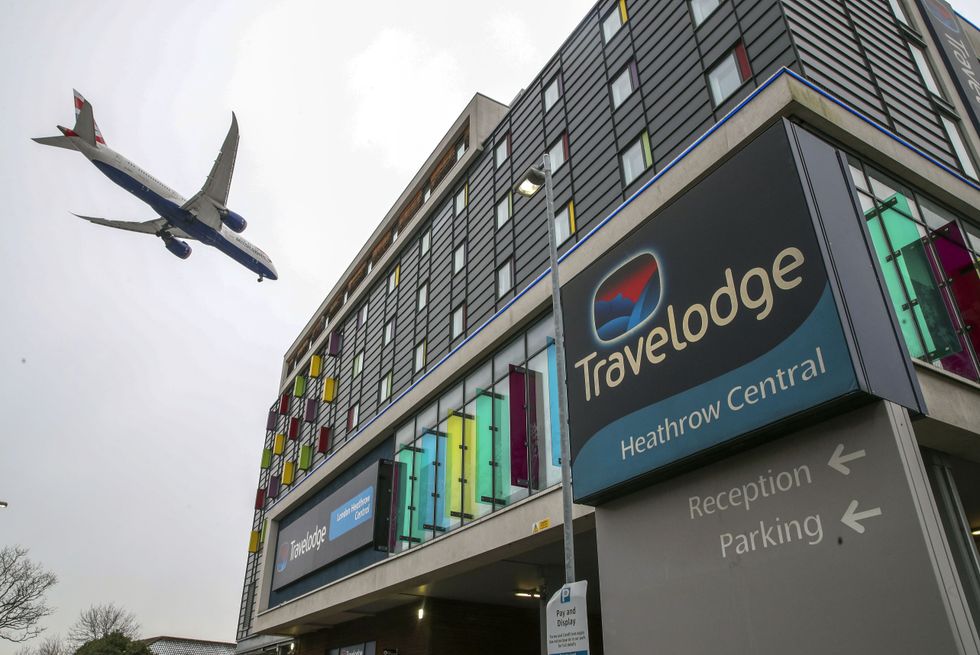 A plane passes over the Travelodge Hotel at Heathrow. Prime Minister Boris Johnson is expected to approve plans to force some travellers arriving to the UK to quarantine in hotels to limit the spread of new coronavirus variants. Picture date: Tuesday January 26, 2021.