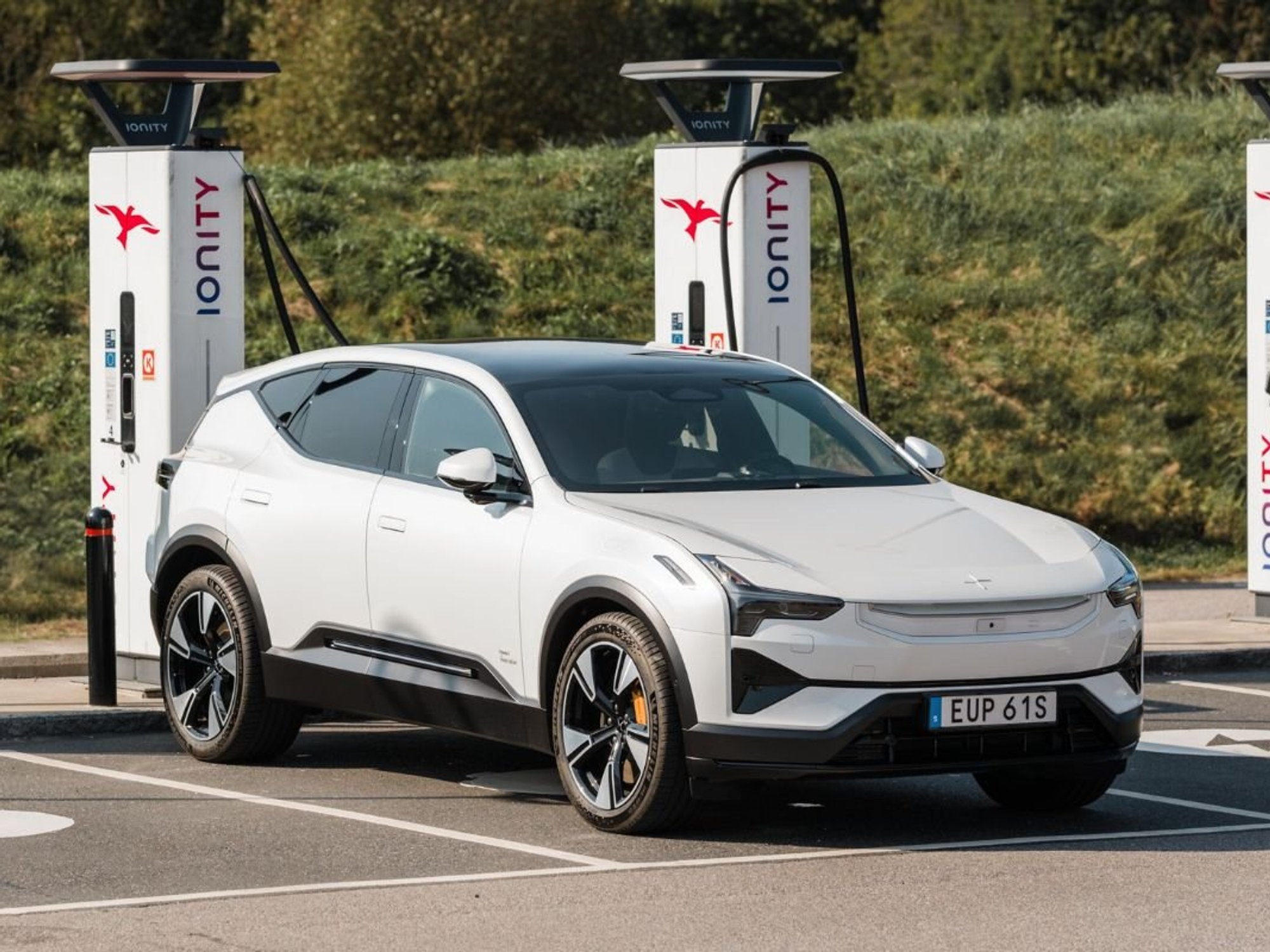 A Polestar electric vehicle charging in public