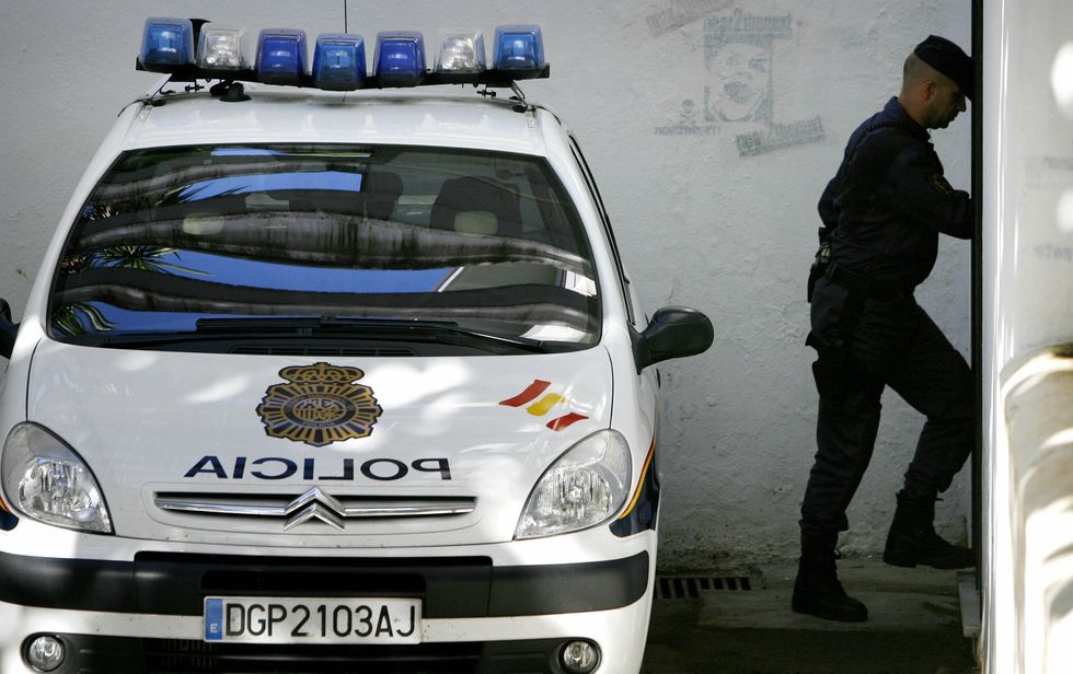 A police car outside a courthouse in Marbella