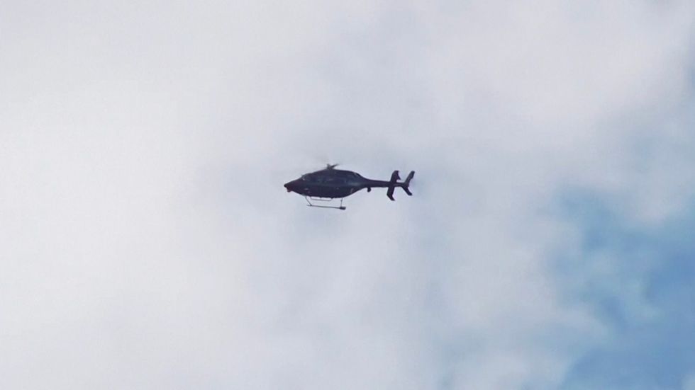 A police helicopter at the scene in Auckland.