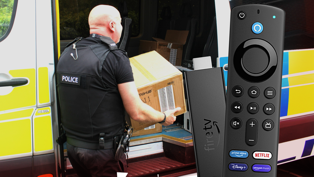 a police officer carries a box of confiscated IPTV streaming boxes with an insert of the Fire TV Stick 4K
