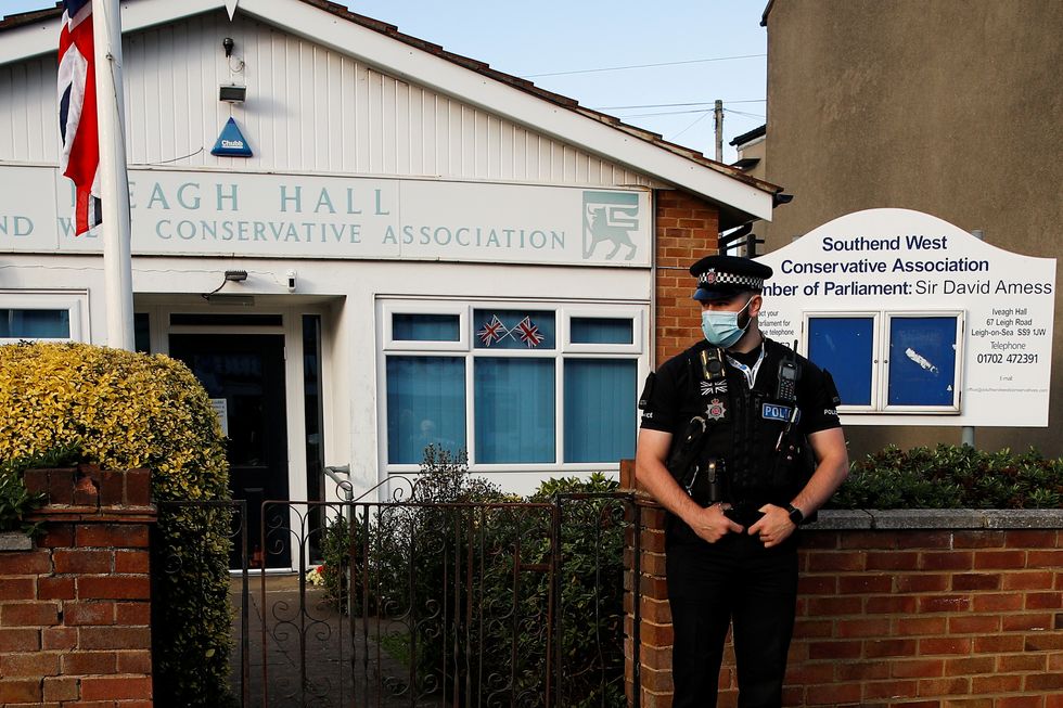 A police officer guards the local conservative association and constituency office of stabbed MP David Amess after he was stabbed during constituency surgery, in Leigh-on-Sea.