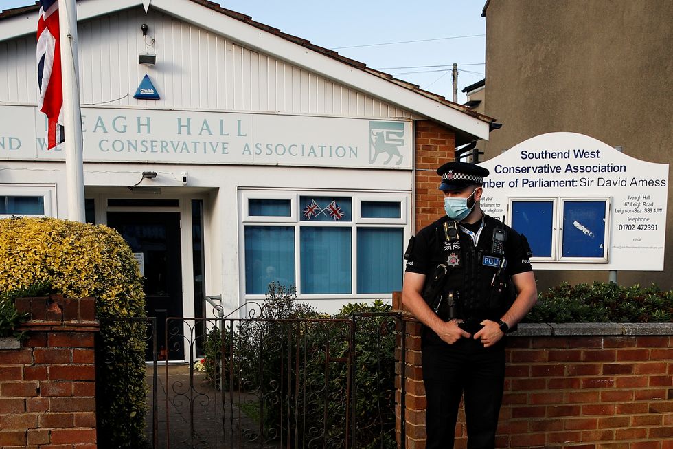 A police officer guards the local conservative association and constituency office of stabbed MP David Amess.