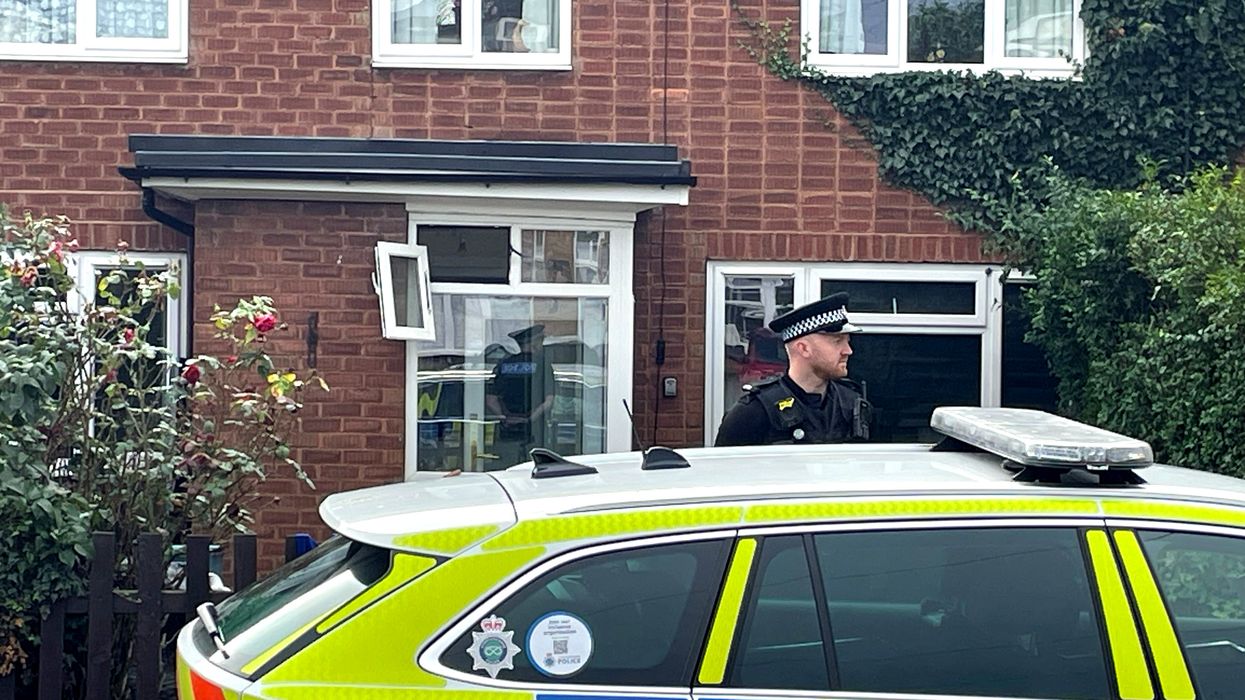 A police officer outside a property in Main Street, Stonnall, Staffordshire, after a man was seriously injured after being bitten by two dogs