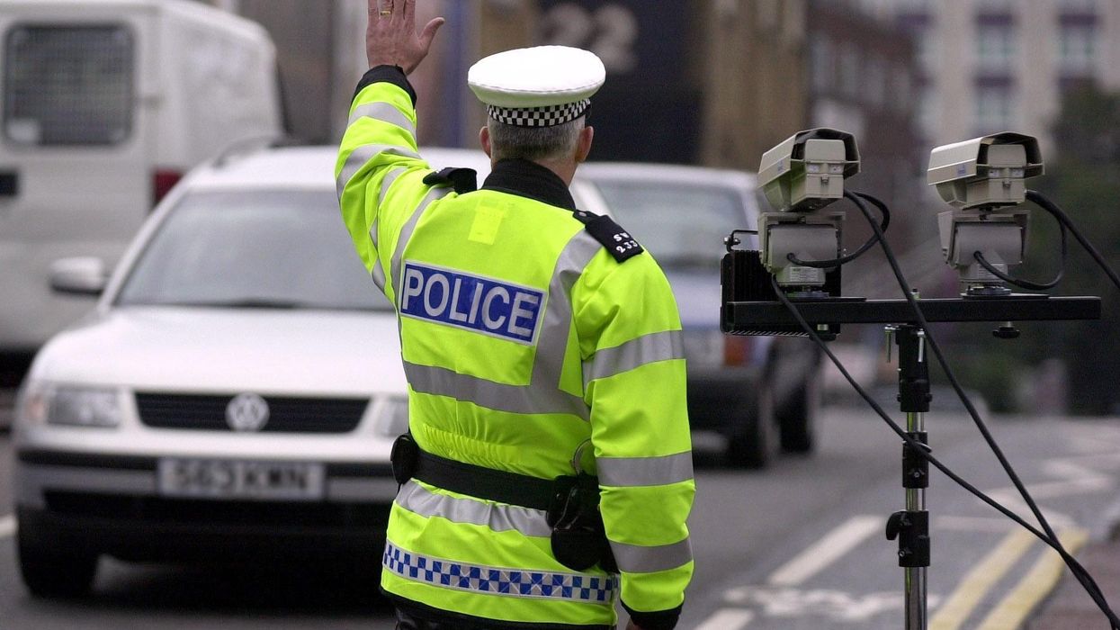 A police officer pulling a car over