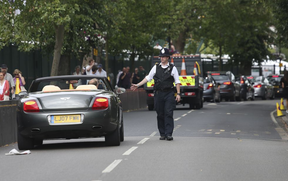 A police officer pulling a driver over