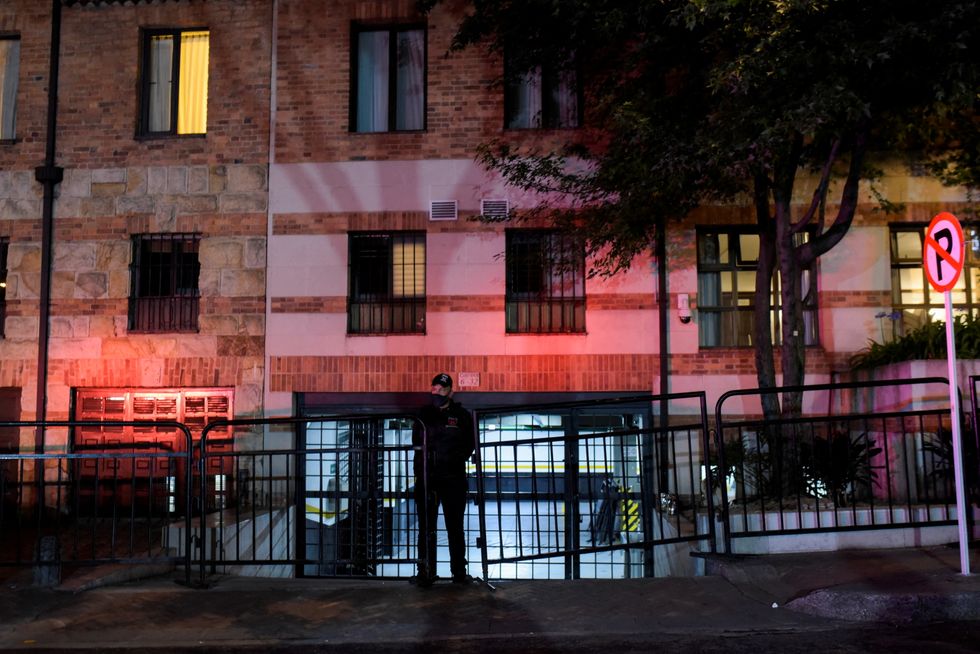 A police officer stands guard outside the Casa Medina hotel, where Taylor Hawkins, drummer of the band Foo Fighters was staying, who died hours before his presentation at the Estereo Picnic festival, in Bogota, Colombia, March 25, 2022. REUTERS/Mariano Vimos NO RESALES. NO ARCHIVES