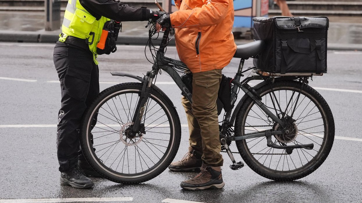 A police officer stopping an electric bike