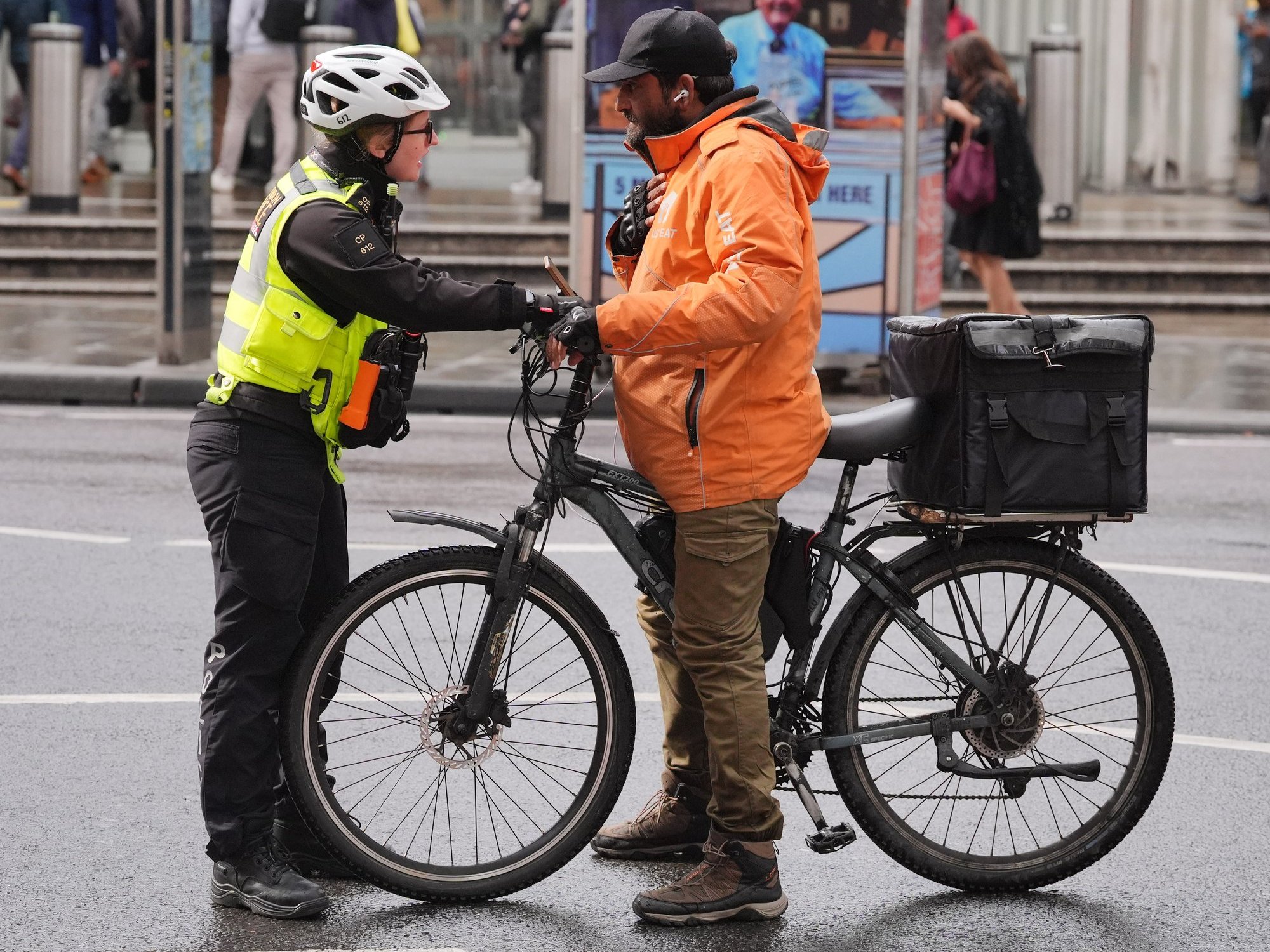 A police officer stopping an electric bike