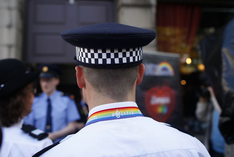 A police officers representative of the gay community arrives for a Gay Pride breakfast at the Northern Whig in Belfast ahead of the Gay Pride parade in Belfast.