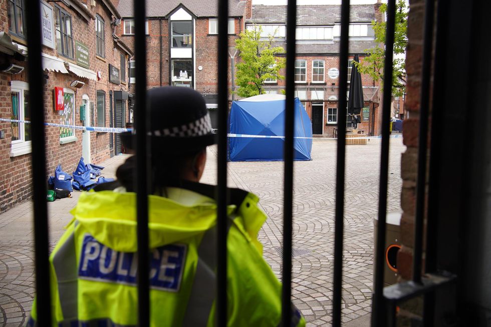 A police tent at the scene on Railway Street in Altrincham, Trafford, where 31-year-old Rico Burton, the cousin of heavyweight boxing champion Tyson Fury, died following a stabbing incident on Sunday. Two men aged 21 and 20 have been arrested, one on suspicion of murder and the other on suspicion of causing grievous bodily harm with intent and murder. Picture date: Monday August 22, 2022.