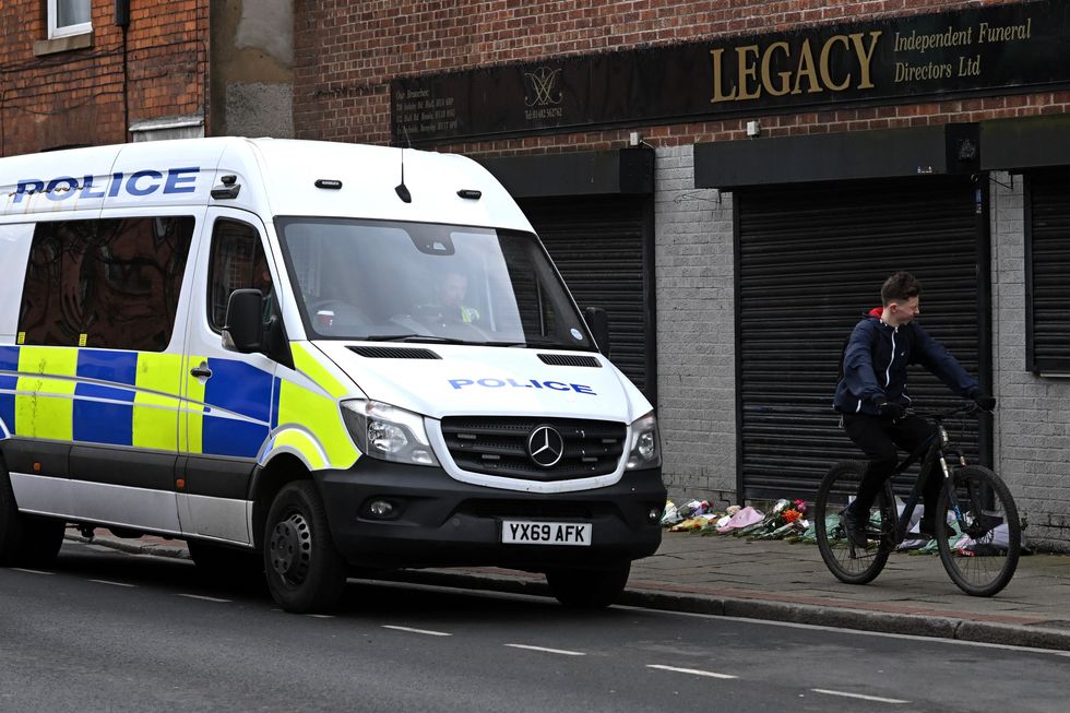 A police van is parked outside a branch of Legacy Independent Funeral Directors in Hull