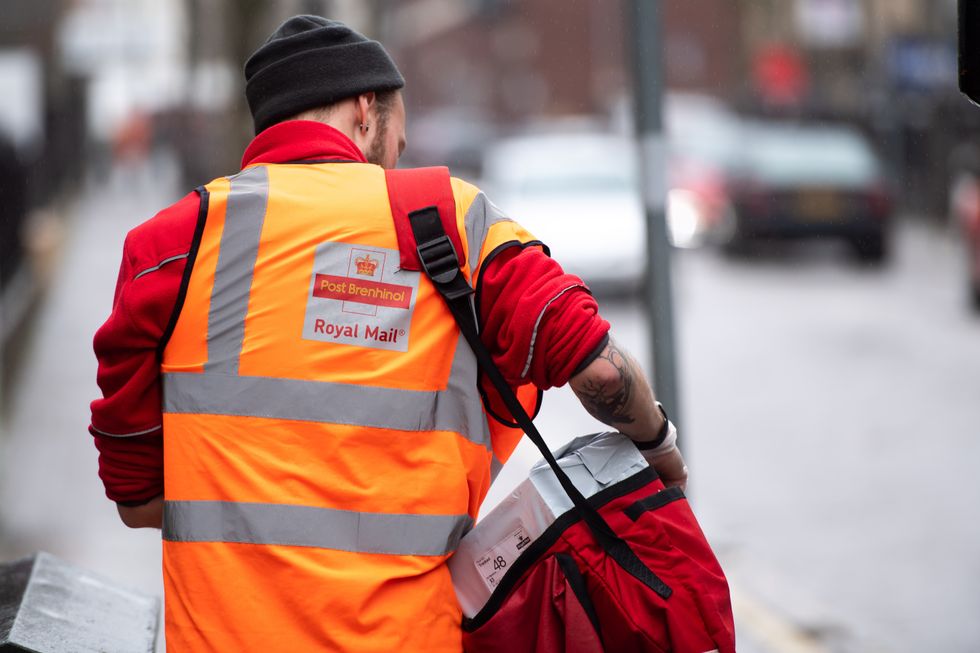 A postal worker from behind on March 17, 2020 in Cardiff, United Kingdom
