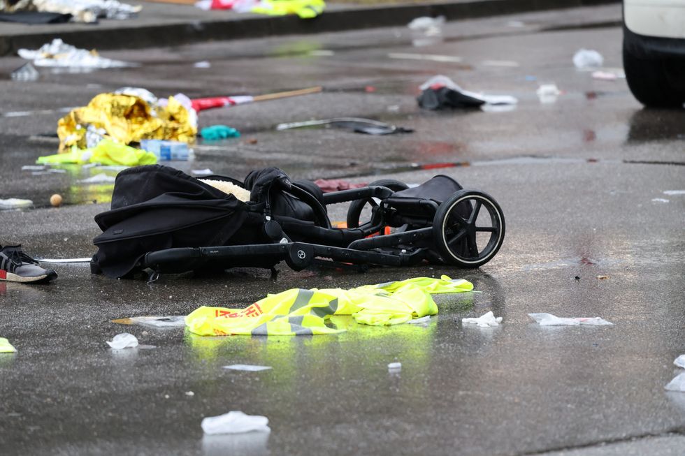 A pram lies on the road beside a car that drove into a crowd\u200b in Munich