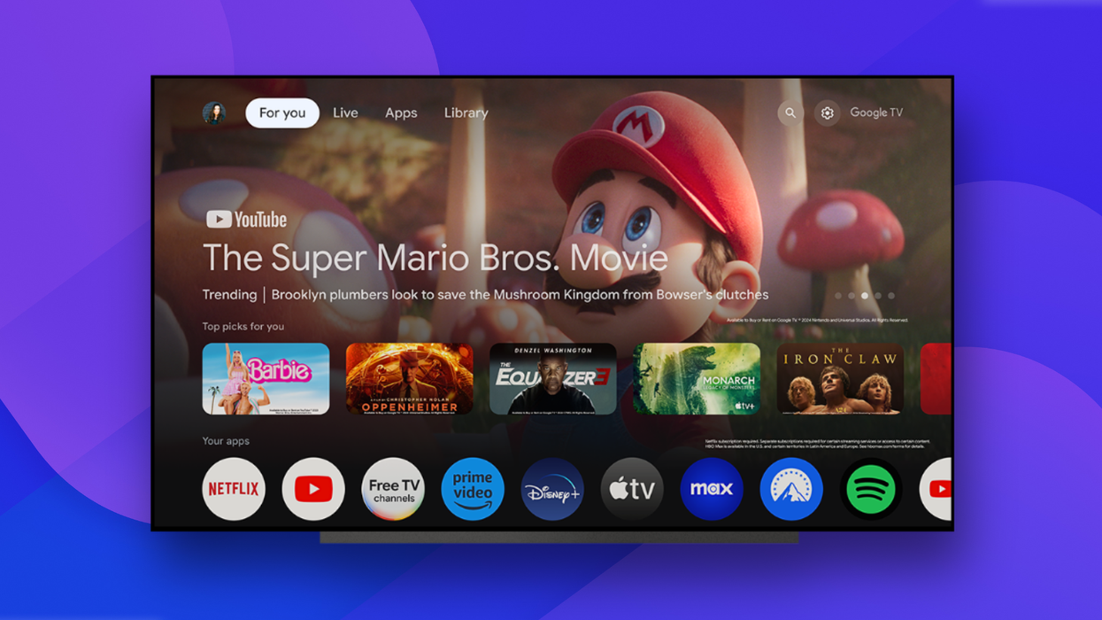 a preview of the new google tv interface pictured on a flatscreen television with a colourful background