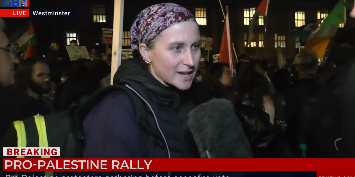 NextImg:‘Do you condemn Hamas?' Moment pro-Palestinian protester REFUSES to answer three times as thousands gather outside Westminster ahead of ceasefire vote