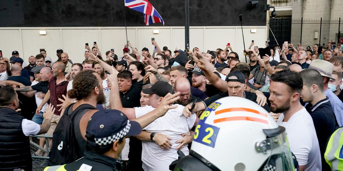 NextImg:Objects thrown at riot police in protest outside Downing Street as officers detain man wearing balaclava