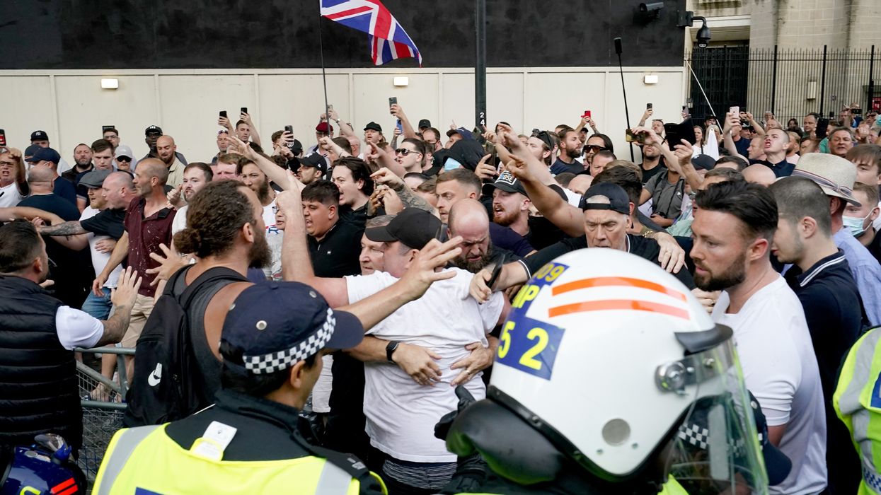 Objects thrown at riot police in protest outside Downing Street as officers make multiple arrests
