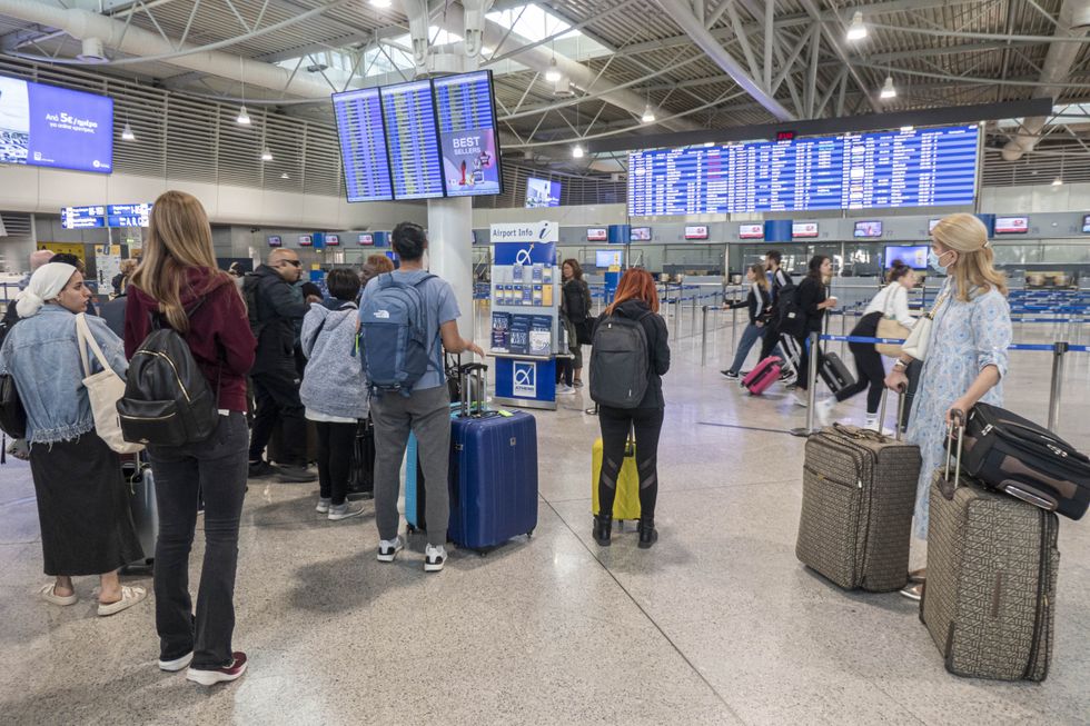 A queue of holidaymakers at an airport