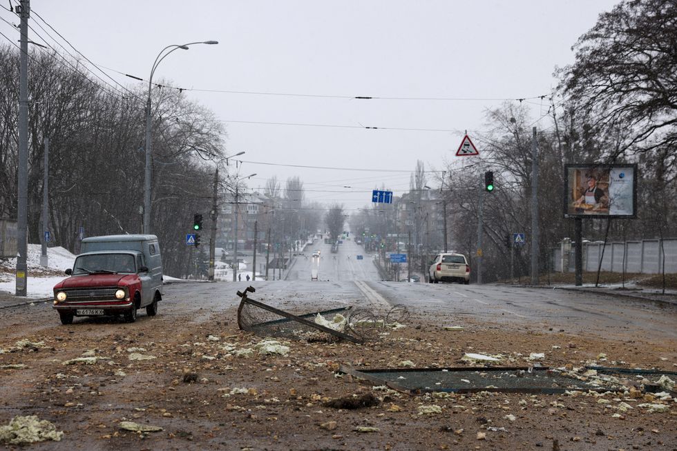 A resident drives through yesterday's blast site after an attack targeted the TV tower as Russia's invasion of Ukraine continues, in Kyiv, Ukraine March 2, 2022. REUTERS/Umit Bektas