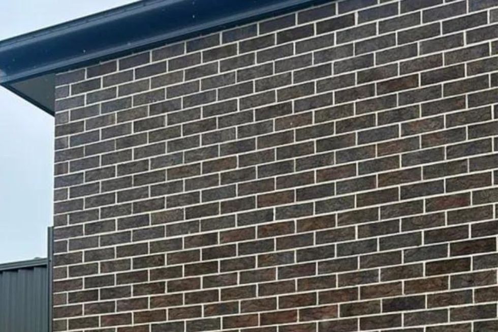 A resident has been left fuming after their next door neighbour builds a new property on the boundary line