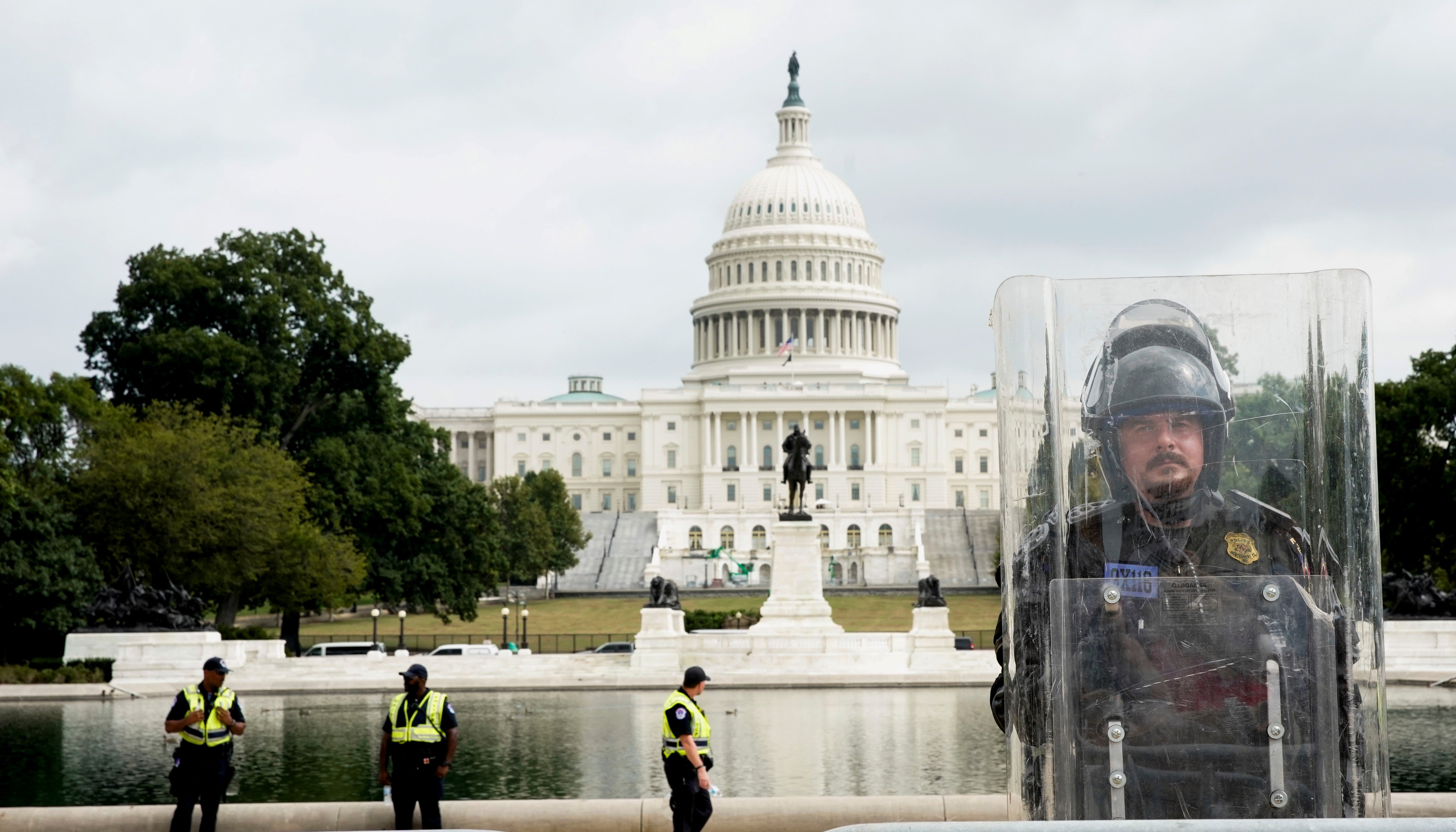 A riot police officer stands guard during a rally in support of defendants being prosecuted in the January 6 attack on the Capitol, in Washington, U.S.