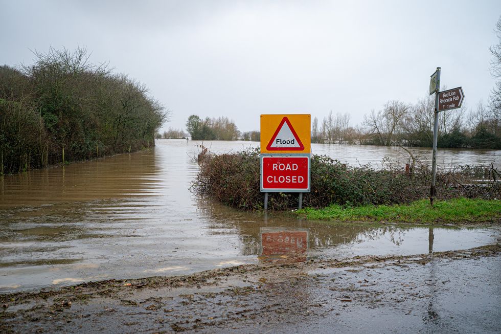 A road is closed due to flooding