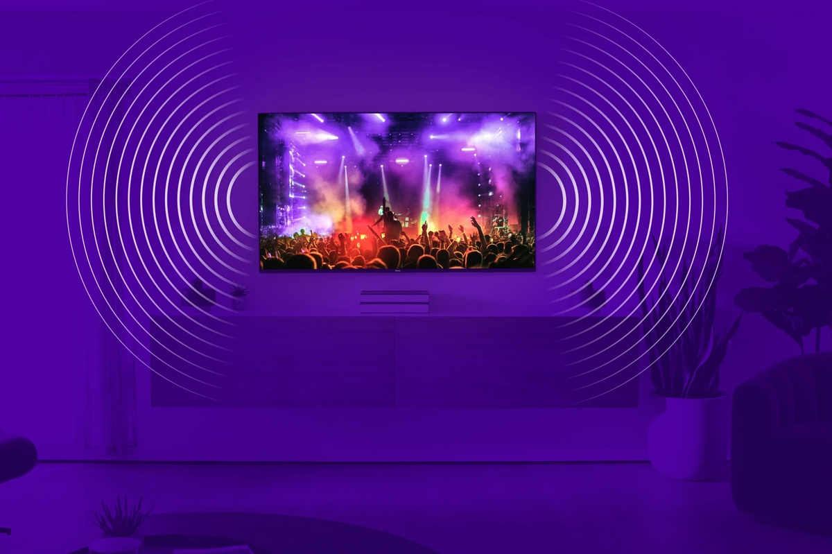 a roku pro series 4k tv is pictured on the wall with lines illustrating sound emitting from the sides of the panel 