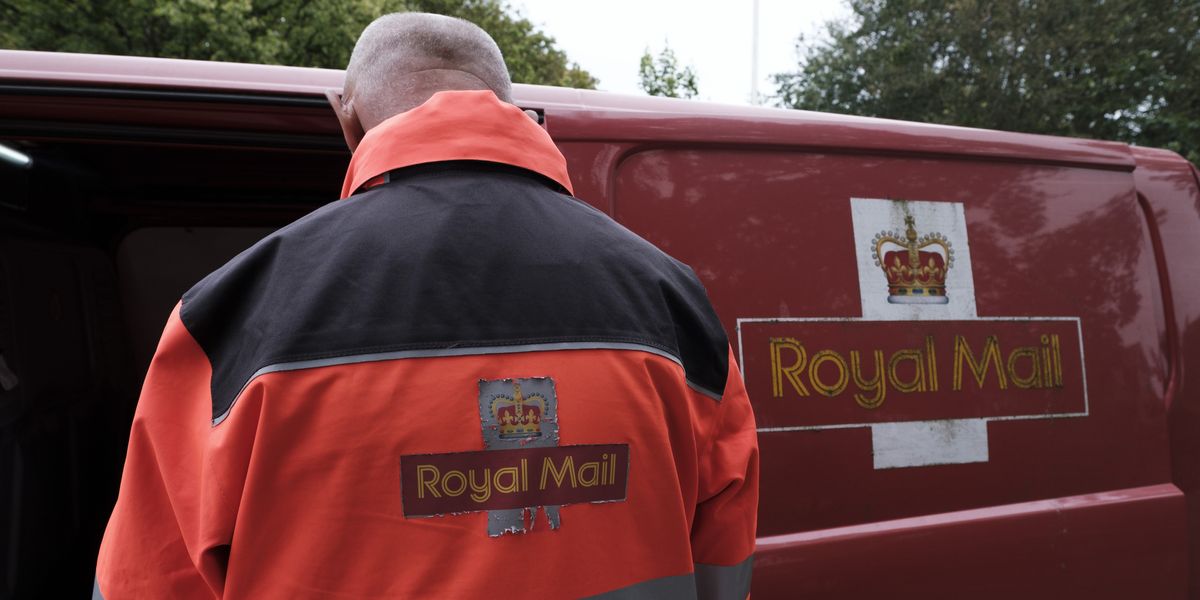 NextImg:Royal Mail postman grabbed by the neck and shoved into van as row explodes