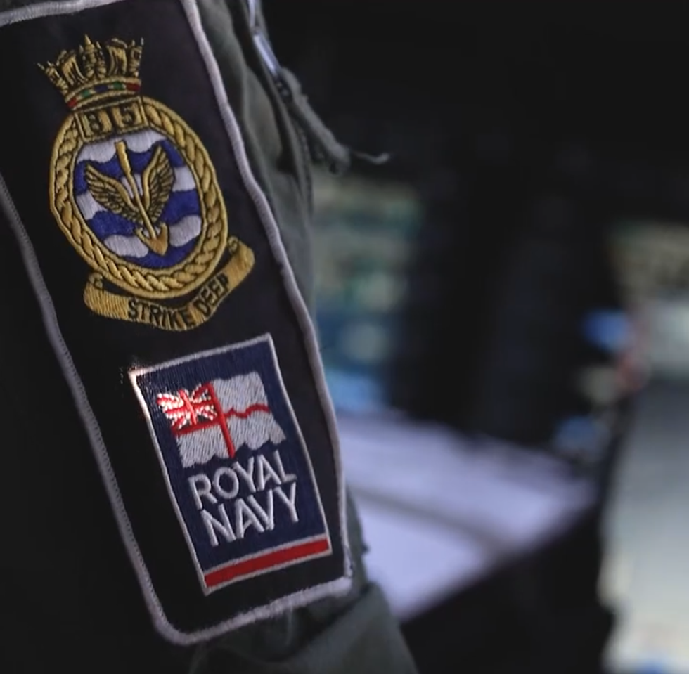A Royal Navy officers badge as they command an military operation