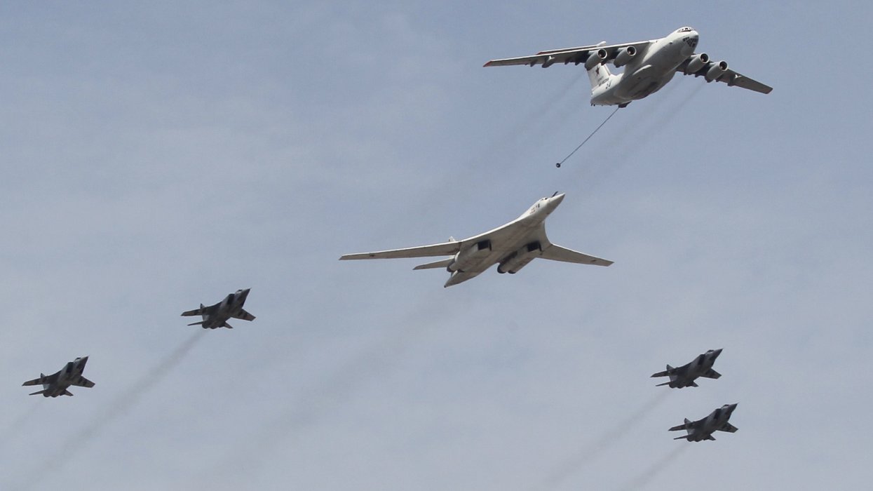 A Russian Tupolev TU-160 jet bomber fly over Red Square during the Victory Day Parade main rehearsals