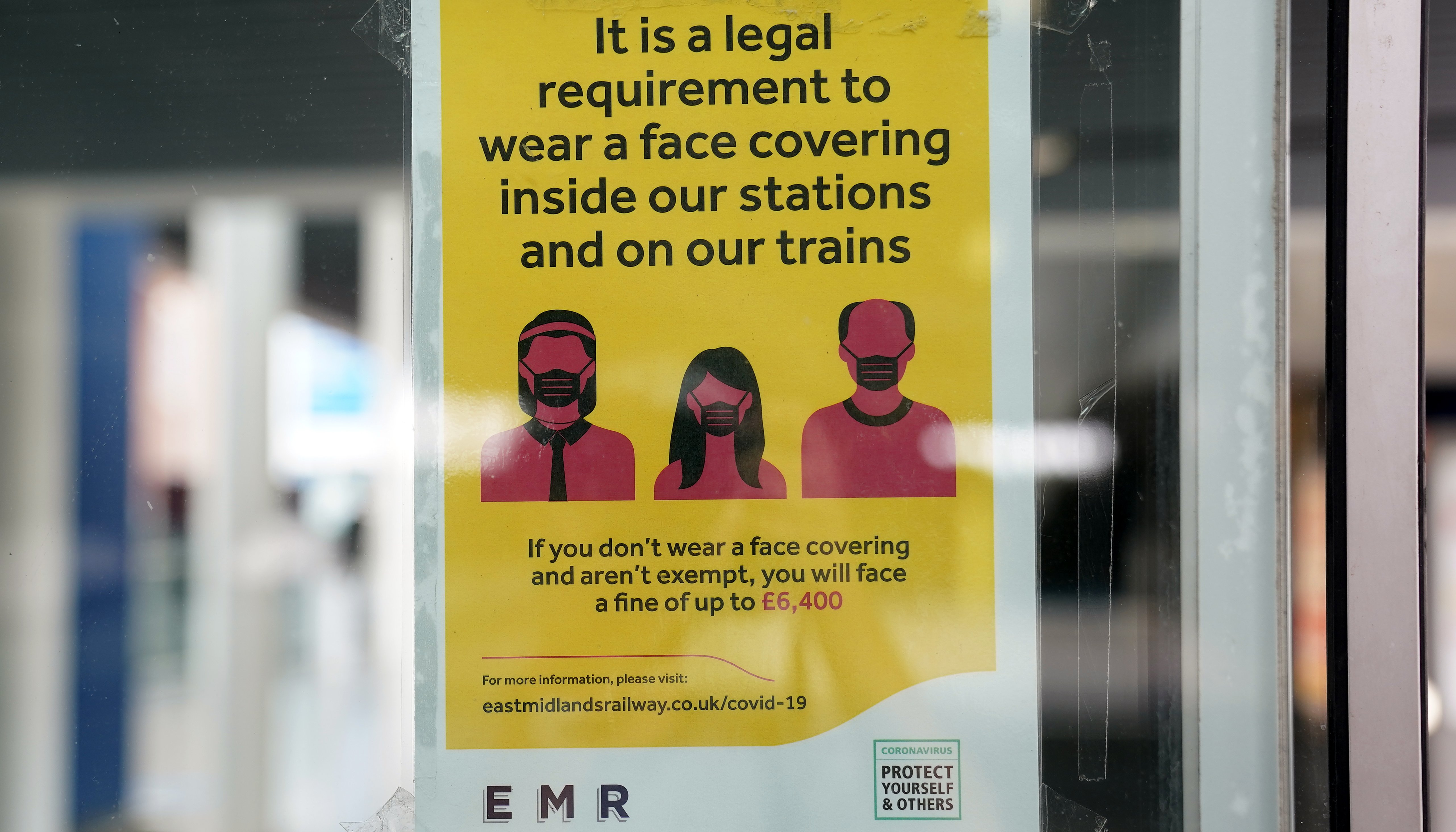 A safety notice for mandatory face masks at the train station in Nottingham.