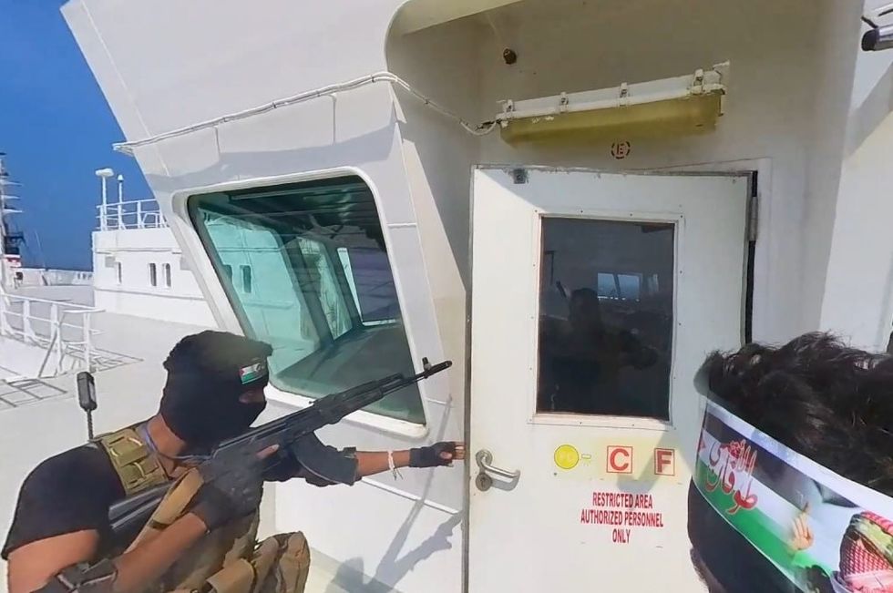 A screen grab captured from a video shows that cargo ship 'Galaxy Leader', co-owned by an Israeli company, being hijacked by Iran-backed Houthis from Yemen in the Red Sea on November 20