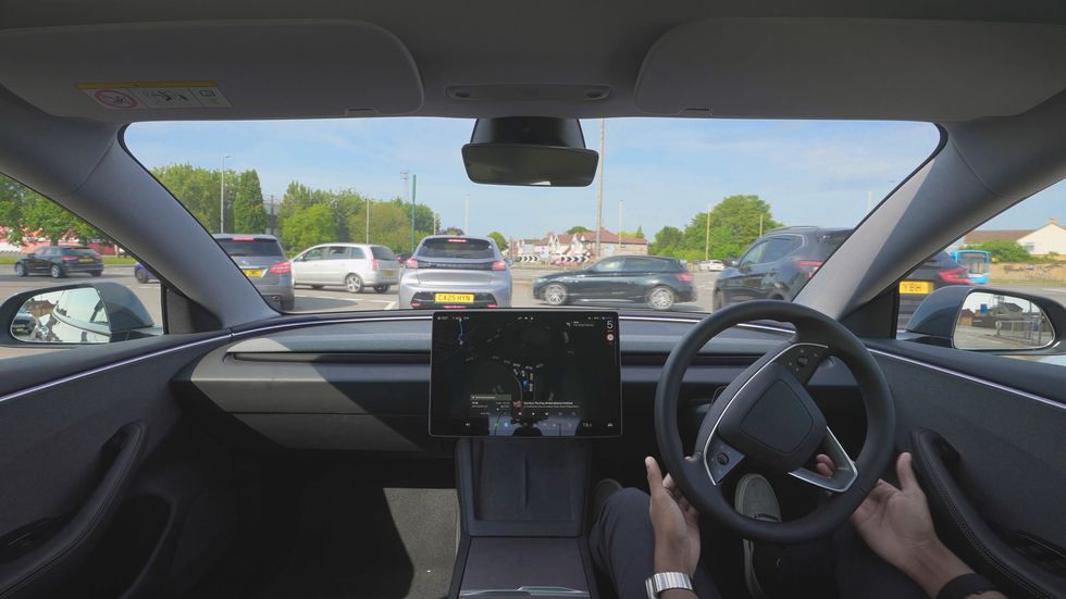 A self-driving Tesla on the Magic Roundabout in Swindon