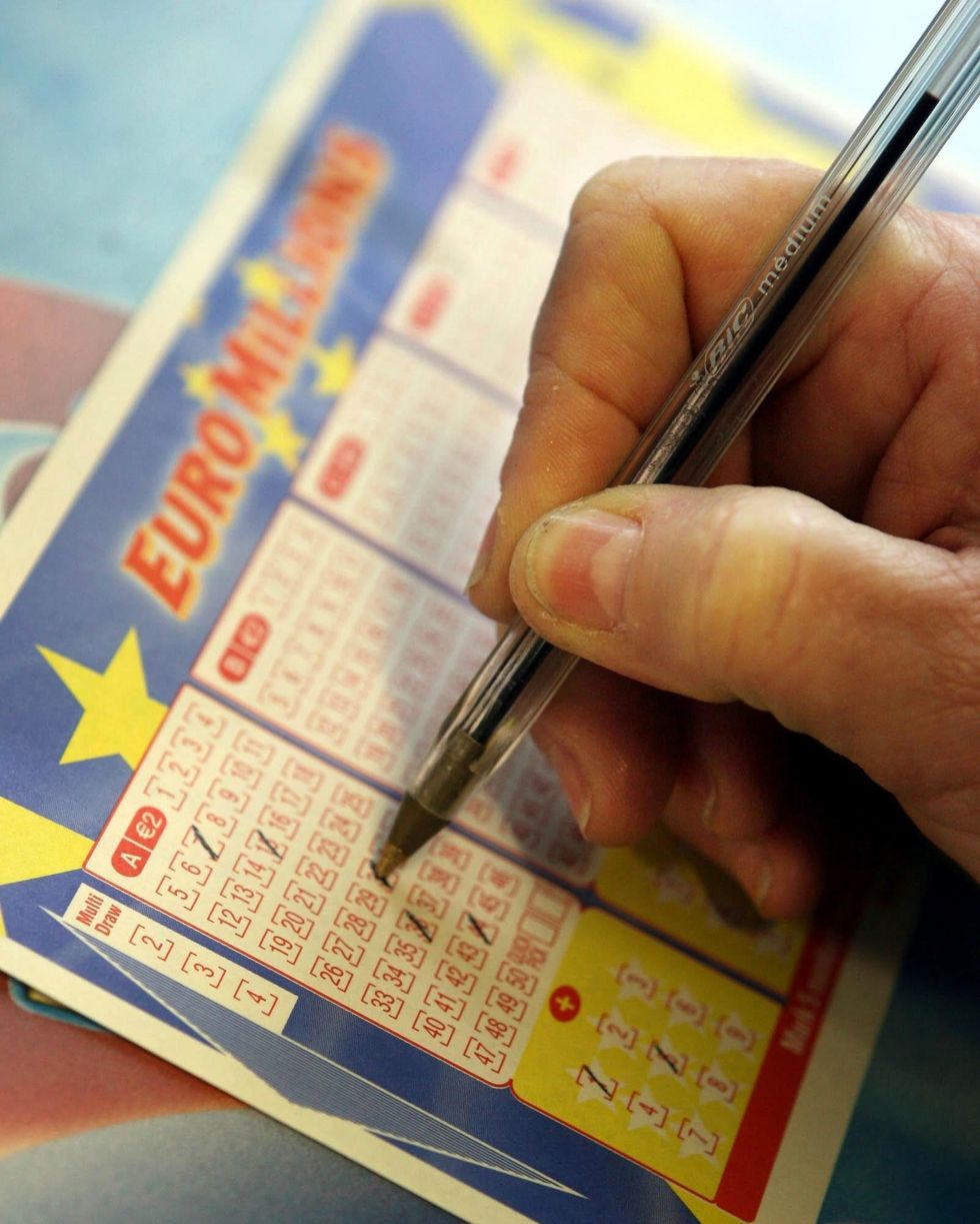 A shopper fills out a Euro Millions Lottery ticket in Dublin, Friday January 27, 2006