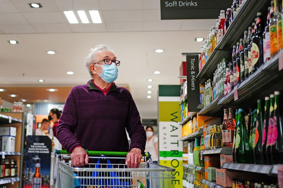 A shopper wearing a facemask in a supermarket in East London, during the easing of lockdown restrictions in England. Picture date: Sunday July 4, 2021.