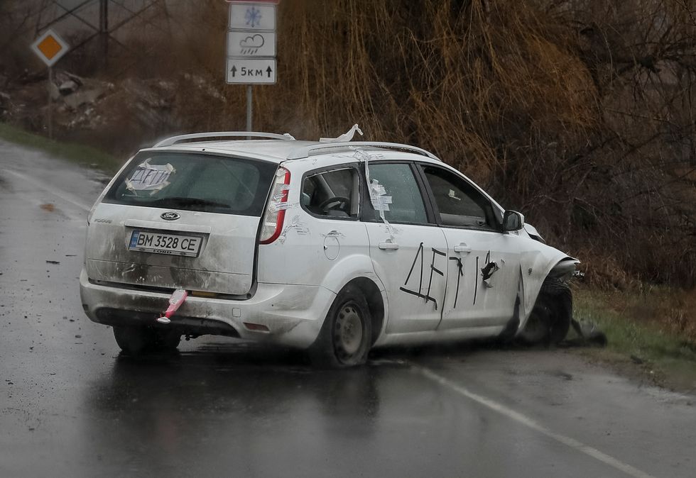 A shot car with inscriptions \%22Children\%22 is seen on the street, amid Russian invasion on Ukraine, in Bucha, Kyiv region