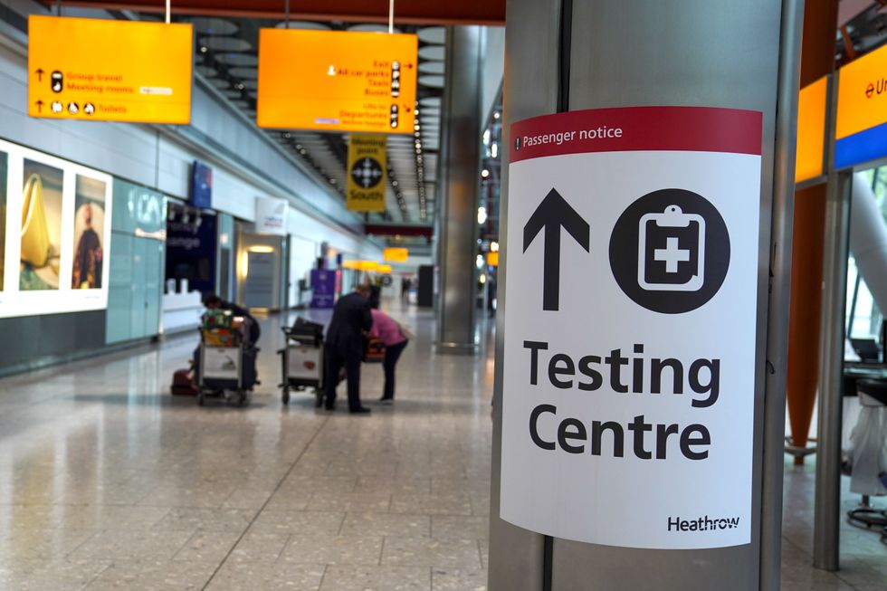 A sign directs passengers to a testing centre