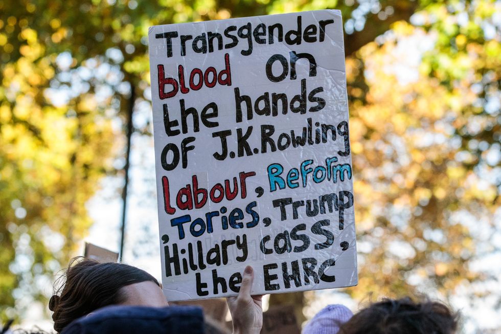 A sign held to protest in favour of trans right and against JK Rowling
