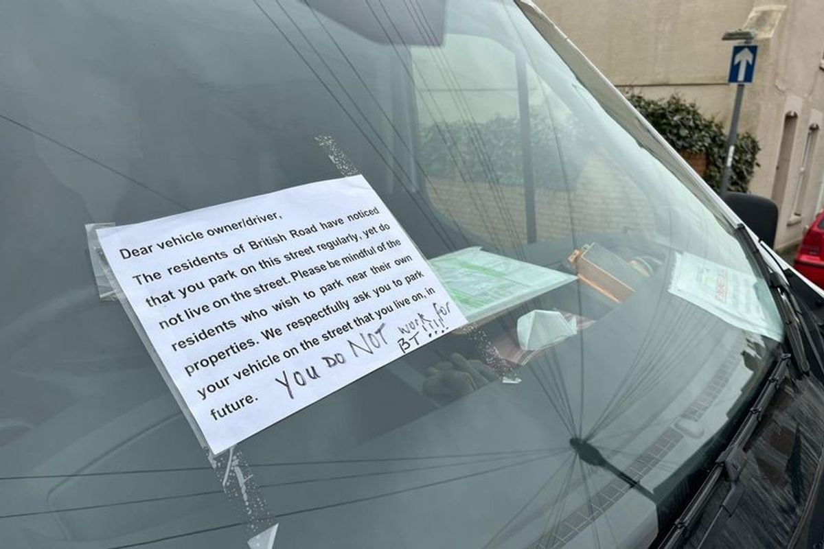 A sign left on a vehicle by an angry resident