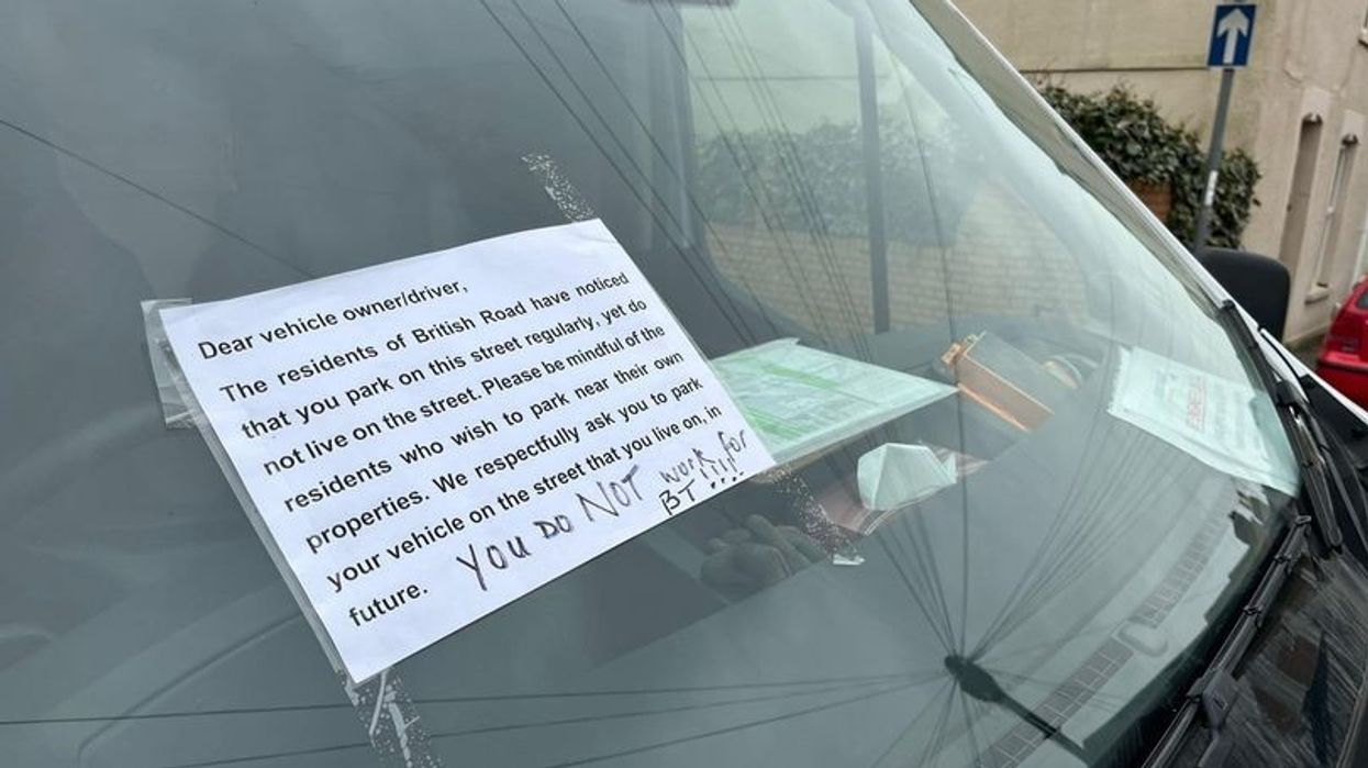 A sign left on a vehicle by an angry resident