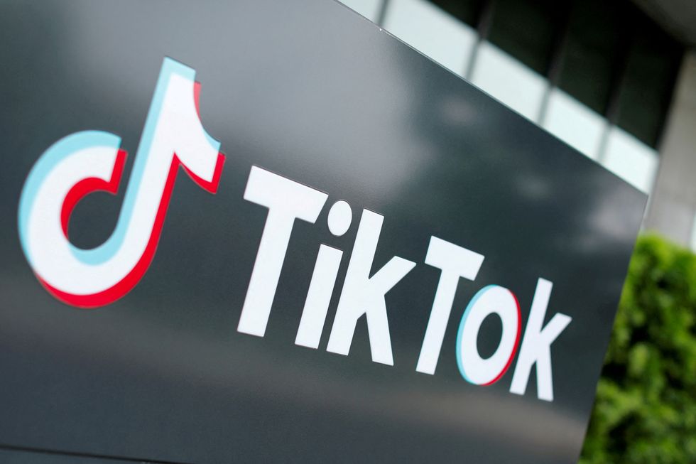 A sign with the TikTok logo on