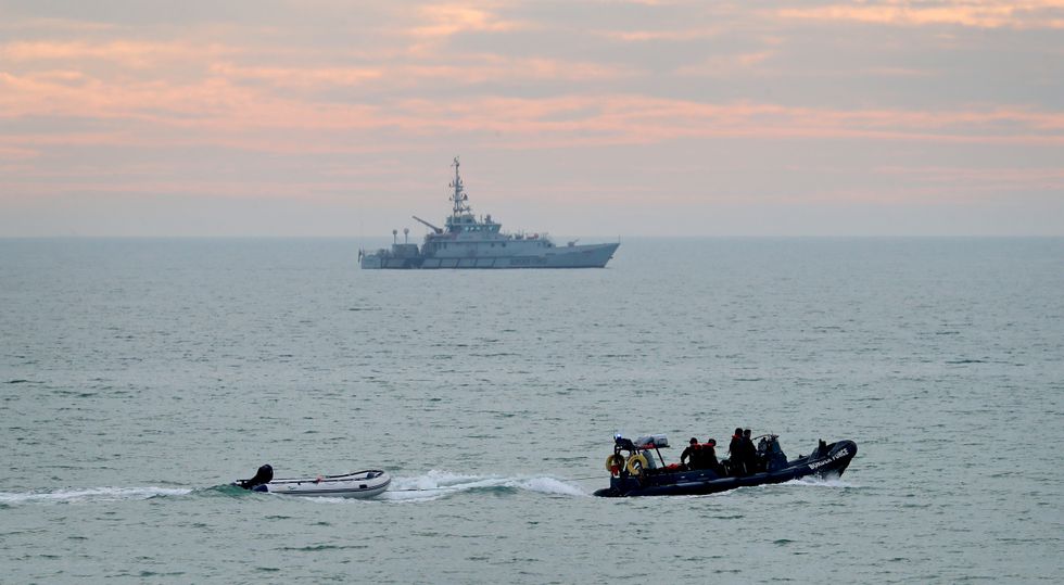 A small boat is towed by a Border Force vessel
