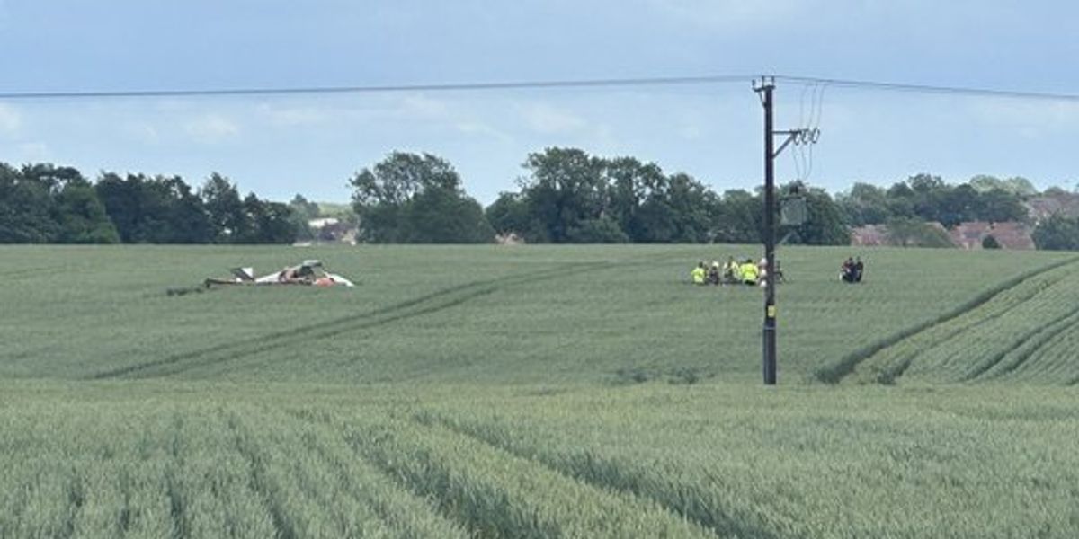 Two people rushed to hospital after aircraft crashes into field near leafy village Two people rushed to hospital after aircraft crashes into field near leafy village