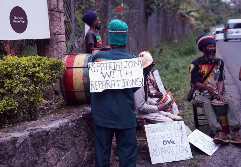 A small protest outside the Fond Doux Cocoa Plantation in Saint Lucia during the visit by the Earl and the Countess of Wessex, as they continue their visit to the Caribbean, to mark the Queen's Platinum Jubilee. Picture date: Wednesday April 27, 2022.