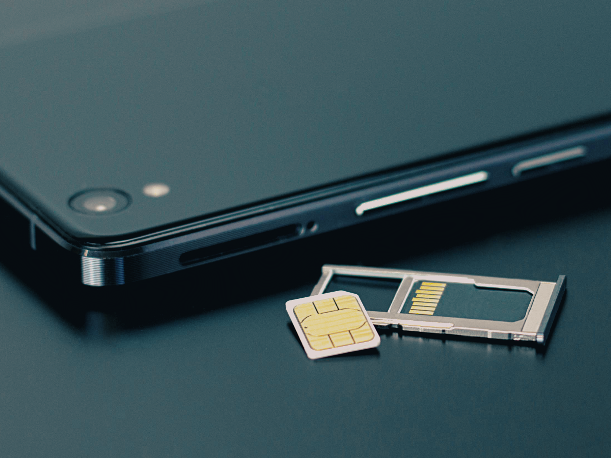 a smartphone with the physical SIM card tray removed
