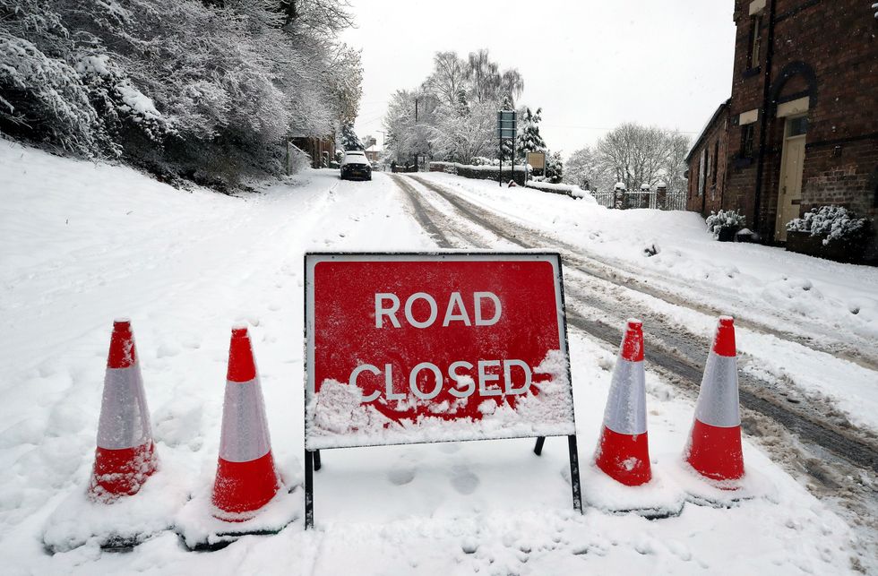 A snow-covered road closed